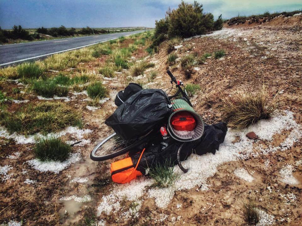 The bike laying in the desert, within the aftermath of two lighting storms