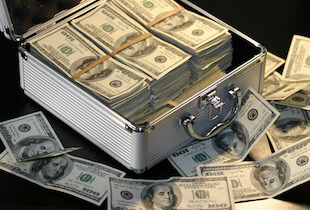A pile of money in a box.