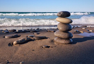 Rocks balancing on the beach.