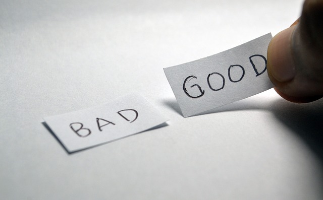 Two pieces of paper, one saying 'good' and the other 'bad'.